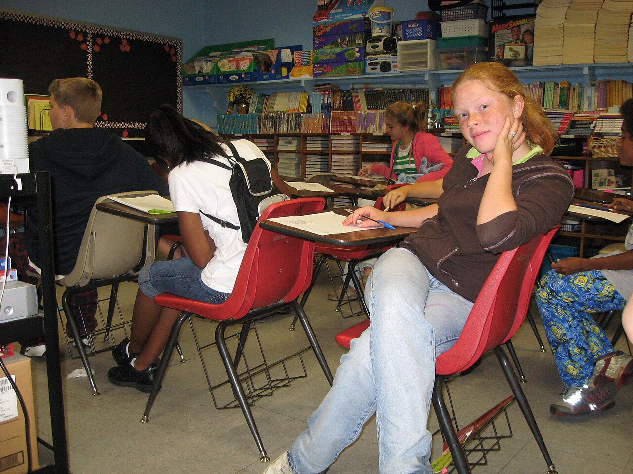 Rows of students seated at desks in a classroom